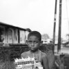 Juozas Cernius - London, Ontario, Canada - Young boy with handmade toy chiva in Portobelo, Panama, 2012.