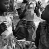 Anna Boyiazis - Los Angeles, California -  UGANDA. Rakai. 2008. Helen and Molly, 14, and Eddie, 10, playing with string.