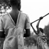 Anna Boyiazis - Los Angeles, California -  UGANDA. Rakai. 2006. Helen and Molly, 12, digging the soil in which they will grow sweet potatoes.