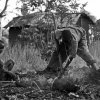 Anna Boyiazis - Los Angeles, California -  UGANDA. Rakai. 2010. Johnny Bosco, 16, and friend, digging charcoal.