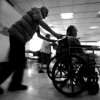 Gili Yaari - Tel Aviv, Israel - A Holocaust survivor pushing another through the halls in the Shaar Menashe Mental Health Center for Holocaust survivors in Pardes Hanna, Israel, 19 August 2010.