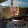 Jacob Yeung - A window reflection and interior of a banquet style restaurant in Chicago's Chinatown Square.