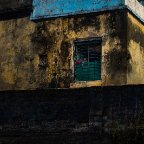 Shweta Jain -A young neighbour always peeping out of her window, as we performed 'Pind Daan' rituals at my grandparents' place. Gaya, Bihar, India. 2015