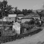 Sascha Richter - A man rides through his village on a motorbike